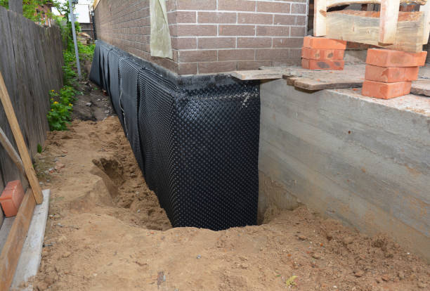 Happy homeowners after waterproofing job in Telford